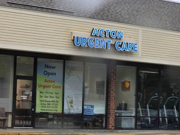 Storefront of Acton Urgent Care with its blue sign